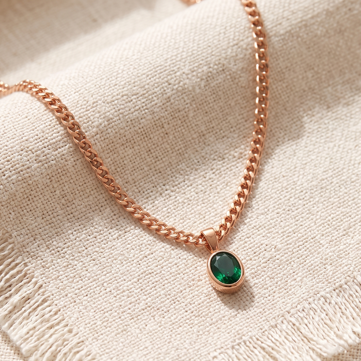 1.98 CT green oval gemstone pendant necklace with polished yellow gold Cuban chain.