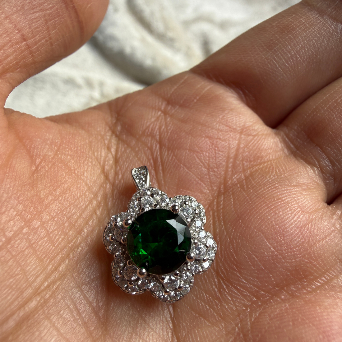 Green gemstone floral halo ring with lab-grown diamonds by Kiashaa Jewellery.