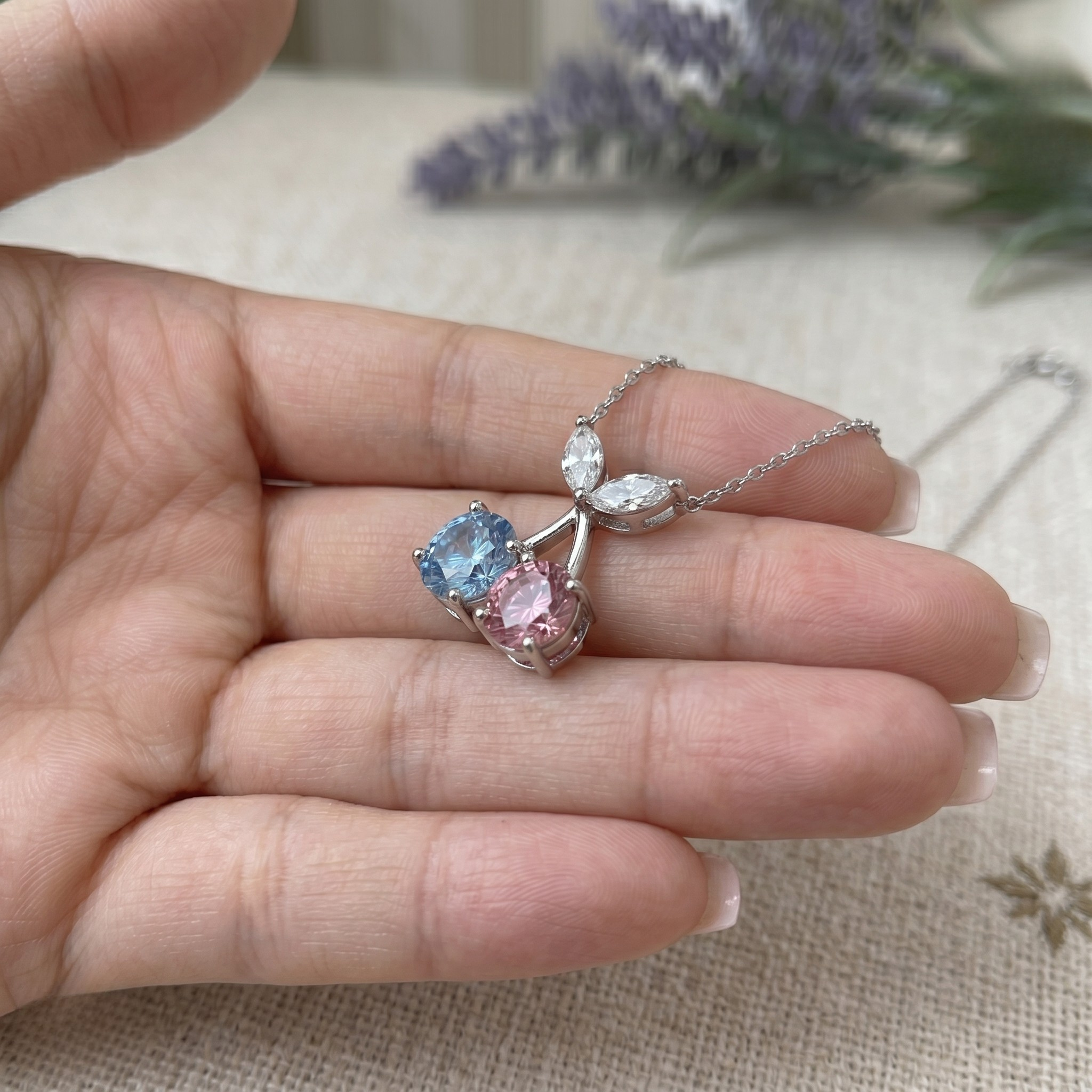 Blue and pink gemstone cherry pendant necklace with marquise lab-grown diamonds by Kiashaa Jewellery.