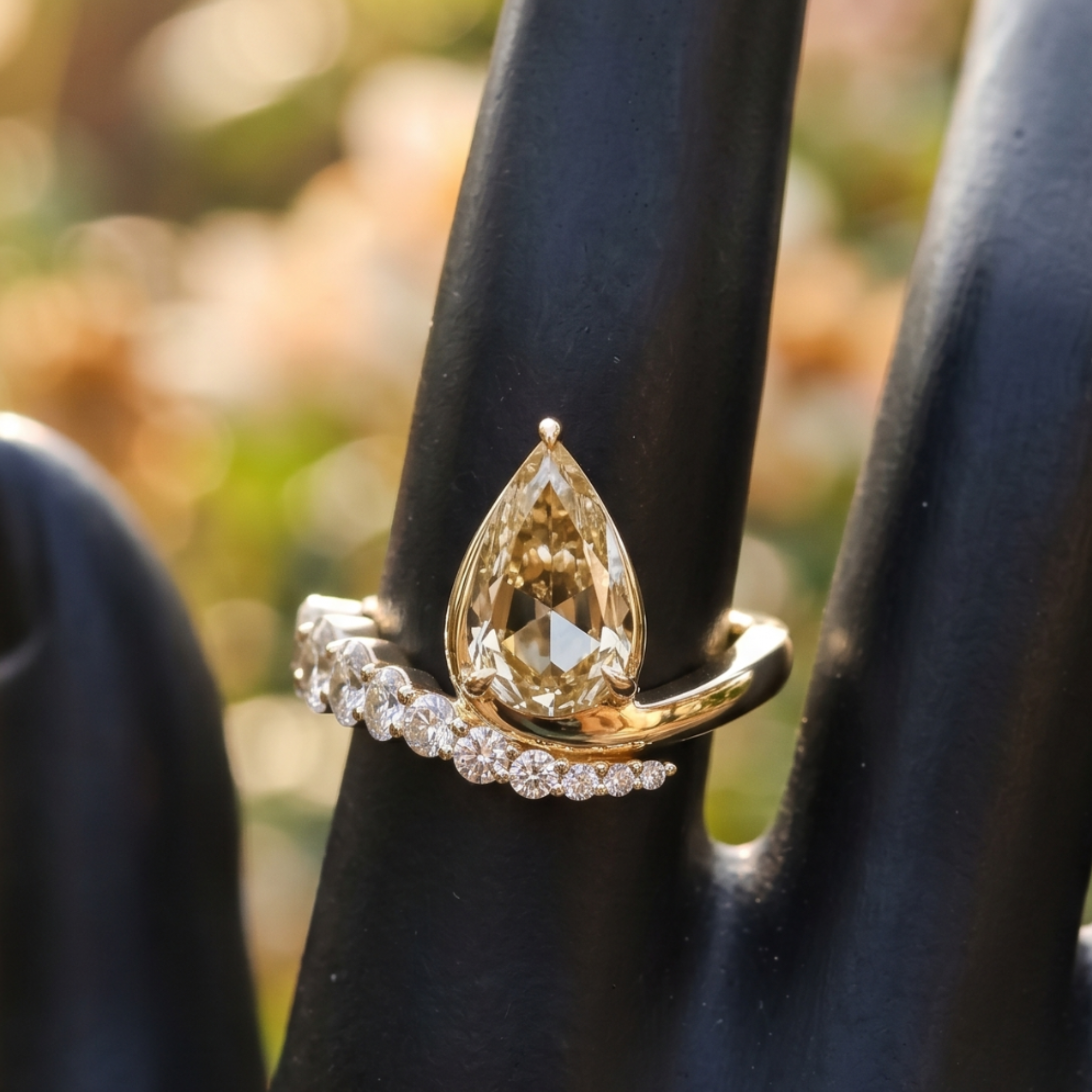 Aurelia 4.50 CTW pear diamond bypass ring by Kiashaa Jewellery featuring a 3 CT pear center diamond in polished yellow gold.