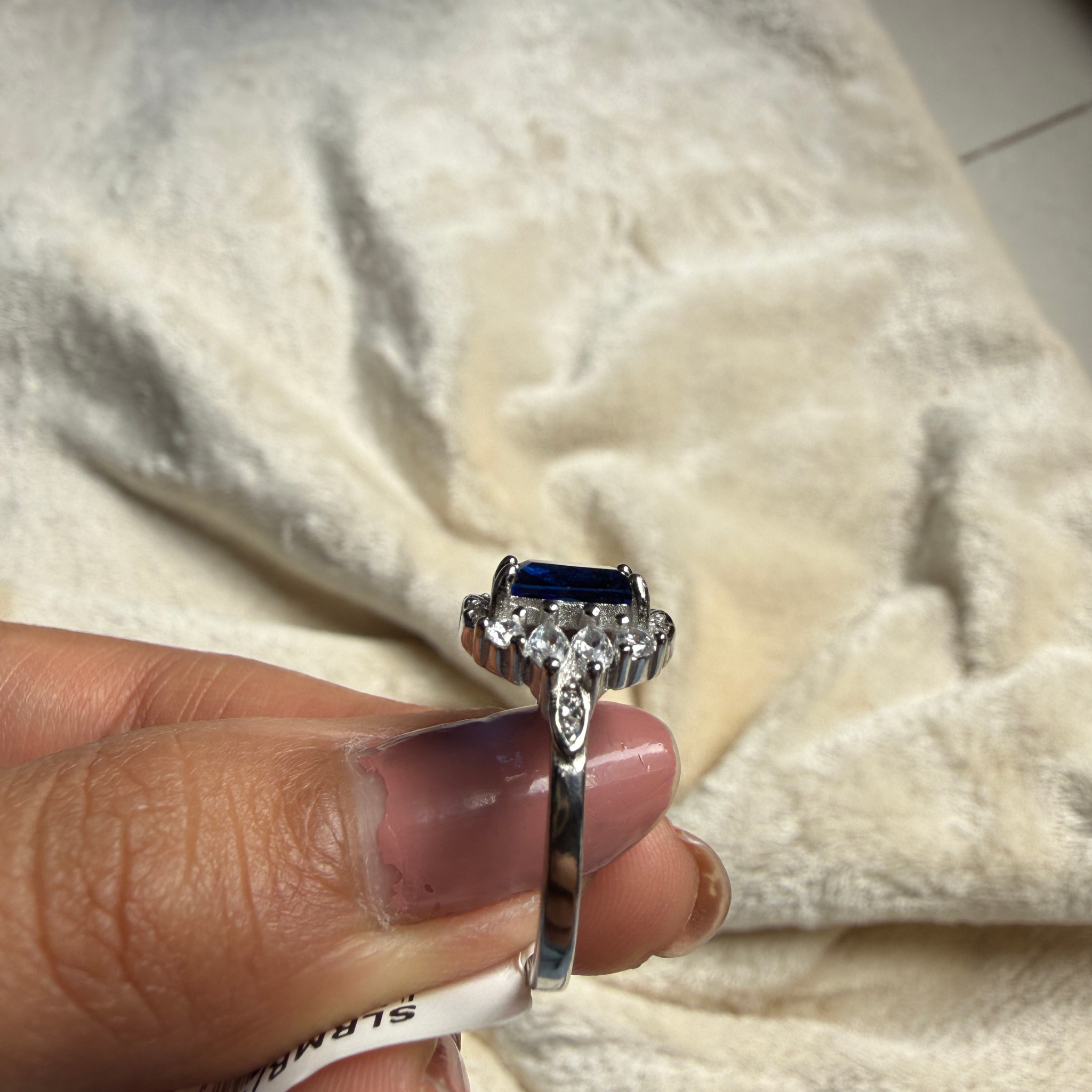 Blue emerald gemstone and lab-grown diamond halo ring by Kiashaa Jewellery.