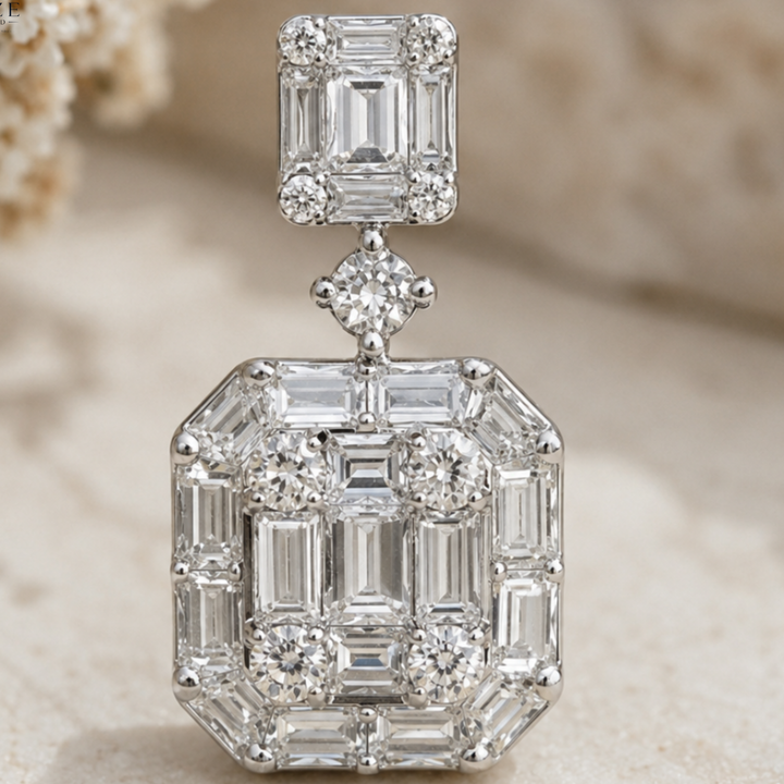 A large rectangular diamond pendant with a silver-toned setting, featuring baguette and round-cut diamonds, photographed against a soft beige background.