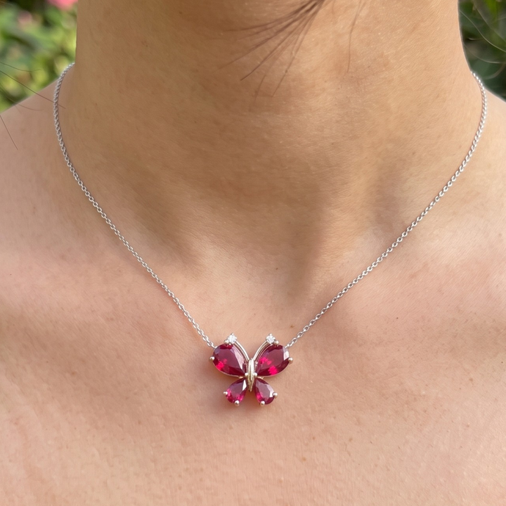 Red pear gemstone butterfly pendant necklace with lab-grown diamond accents by Kiashaa Jewellery.