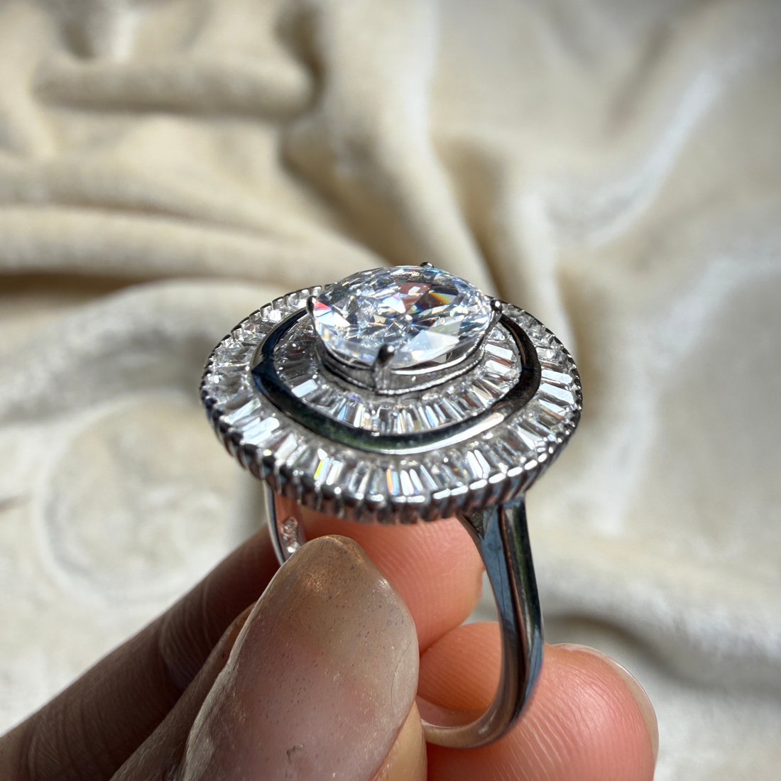 Oval and baguette lab-grown diamond double halo ring by Kiashaa Jewellery.