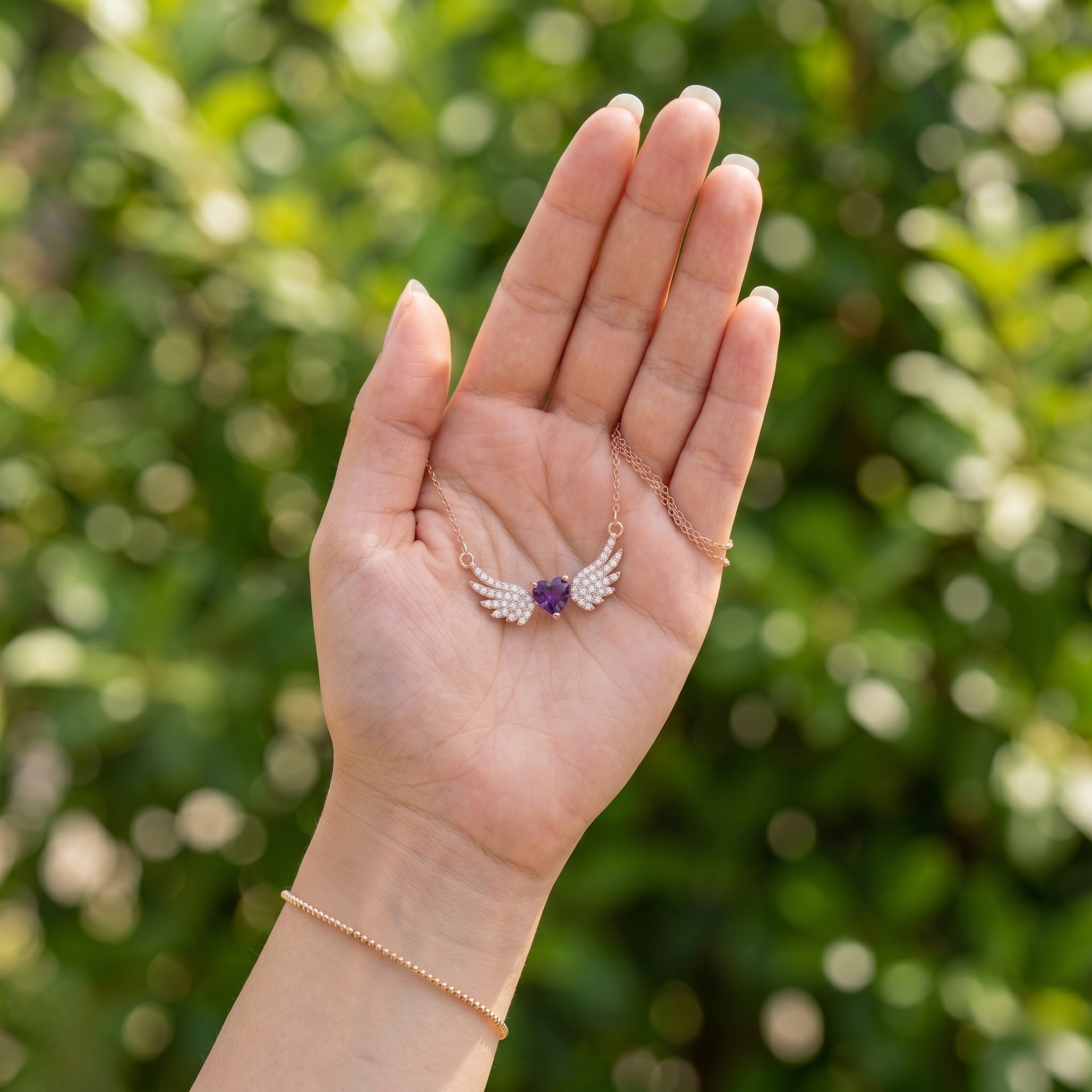 Purple heart gemstone angel wing pendant necklace in rose gold by Kiashaa Jewellery.