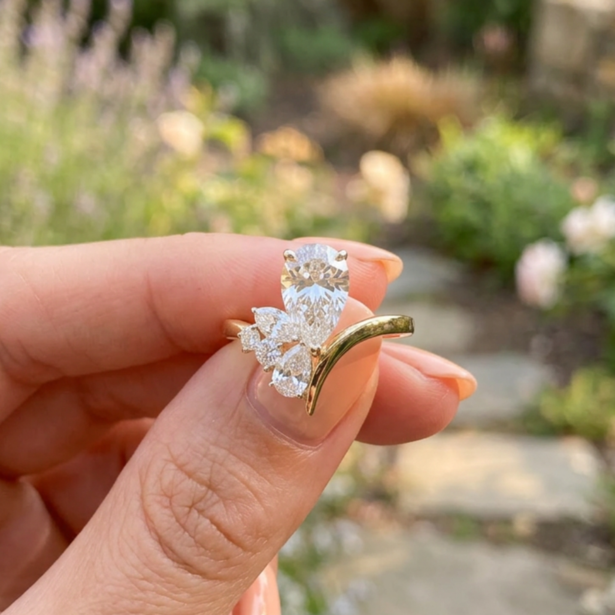 Flora Embrace 3 CTW lab-grown diamond ring by Kiashaa Jewellery with a 2 CT pear center and multi-shape side diamonds.