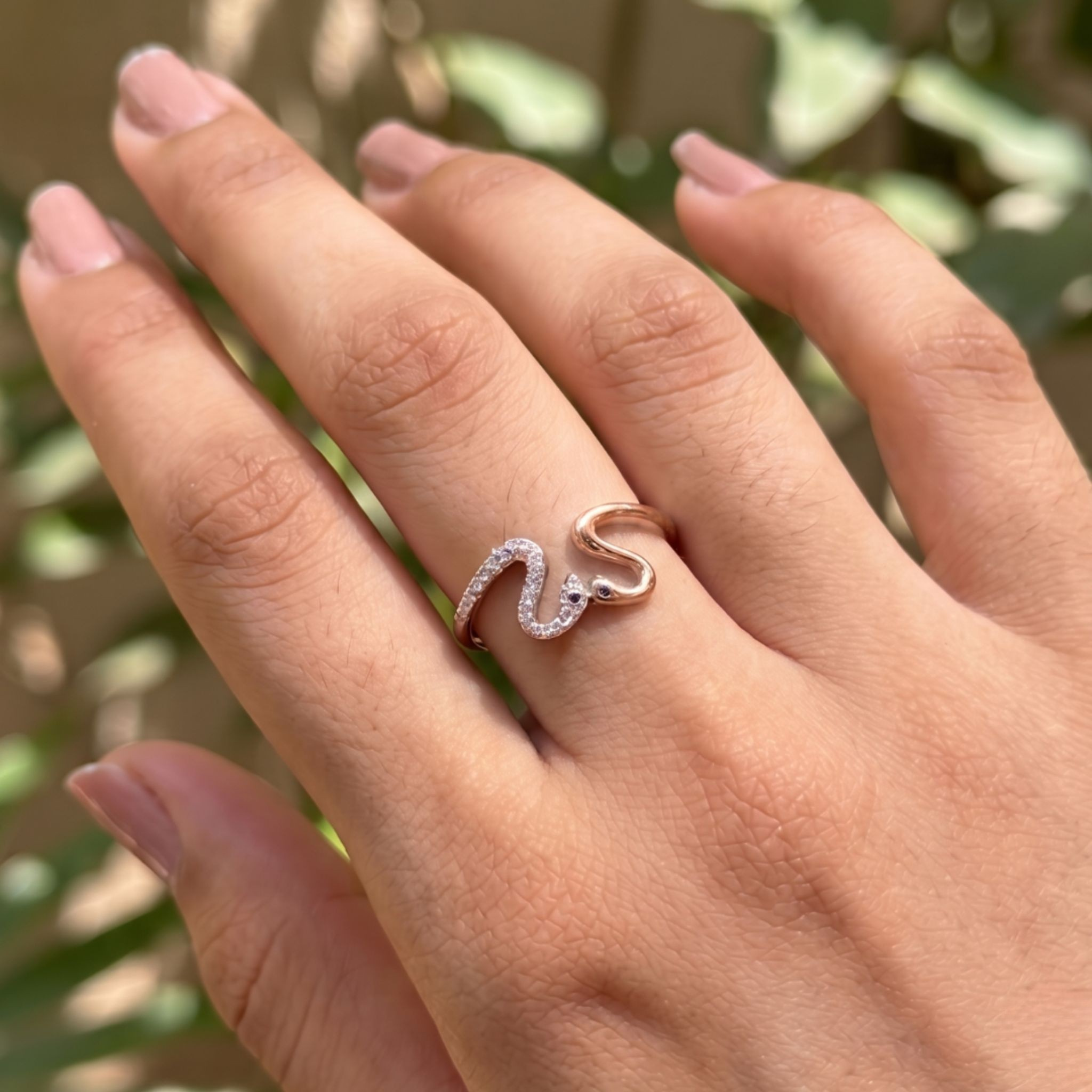 Romantic open ring featuring two swans forming a heart-shaped design.