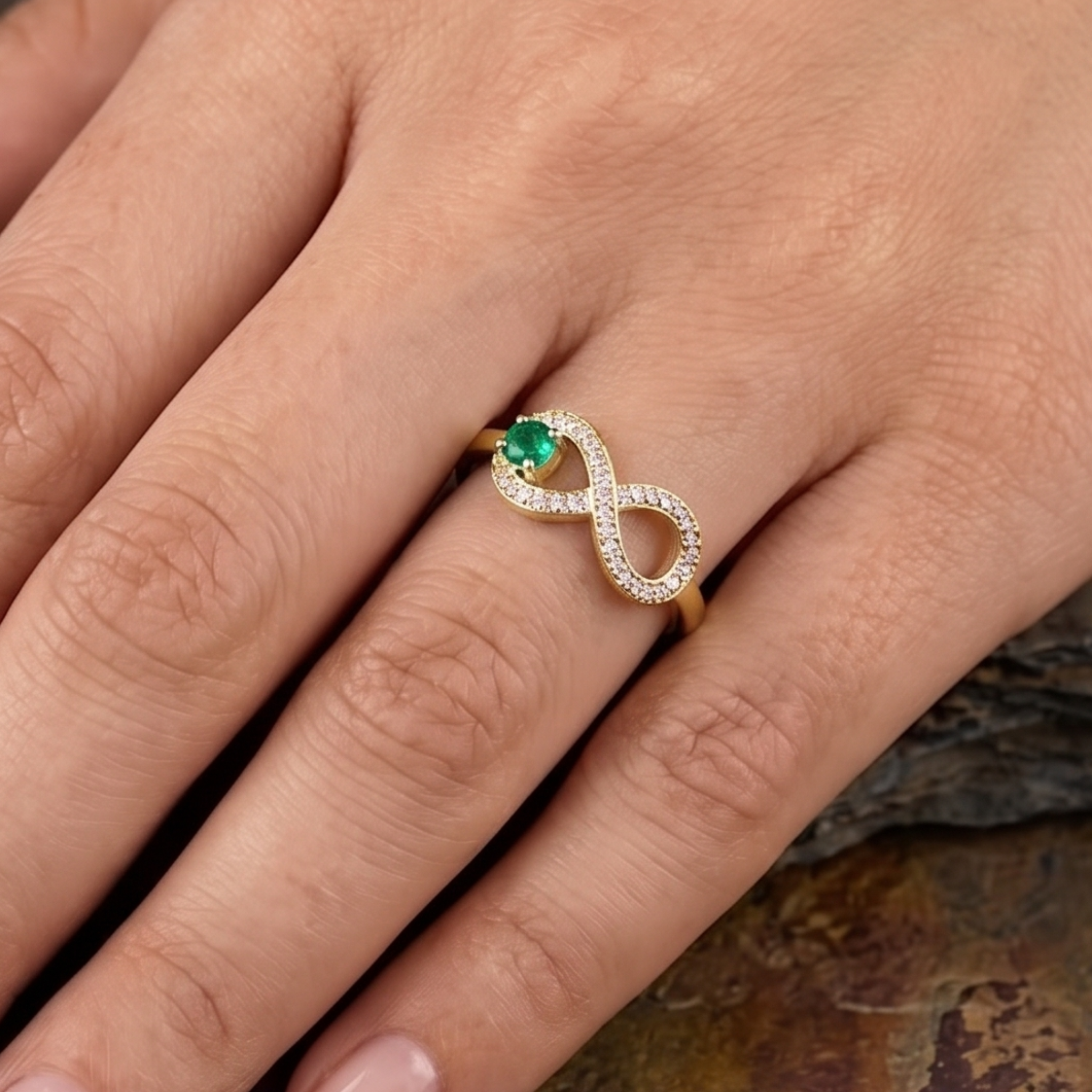Green diamond infinity ring by Kiashaa Jewellery in polished yellow gold.