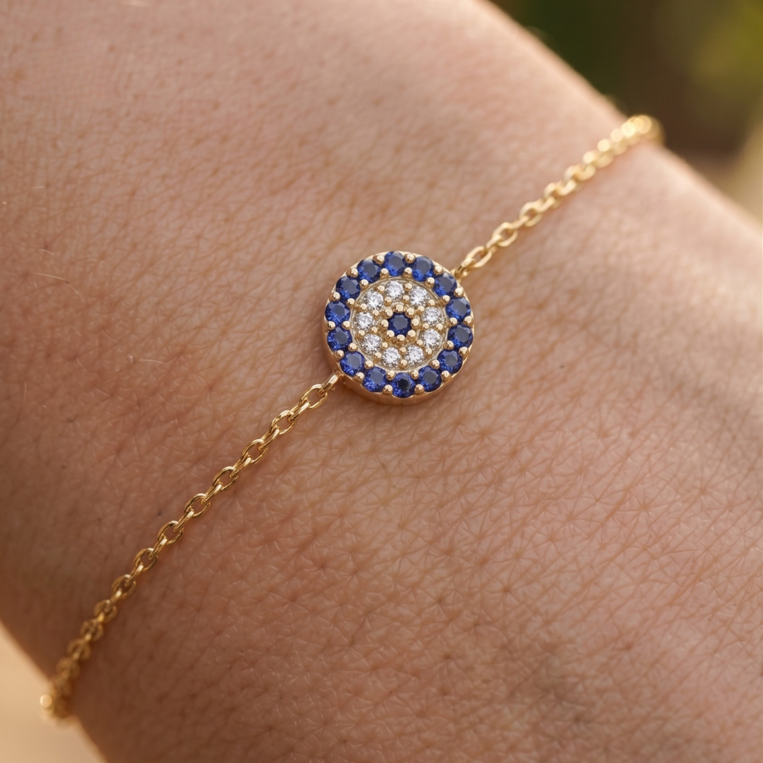 1.00 CT blue gemstone and diamond evil eye bracelet in yellow gold by Kiashaa Jewellery.