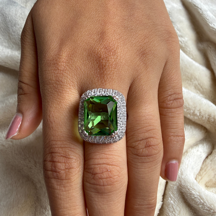Green emerald-cut gemstone and lab-grown diamond double halo ring by Kiashaa Jewellery.