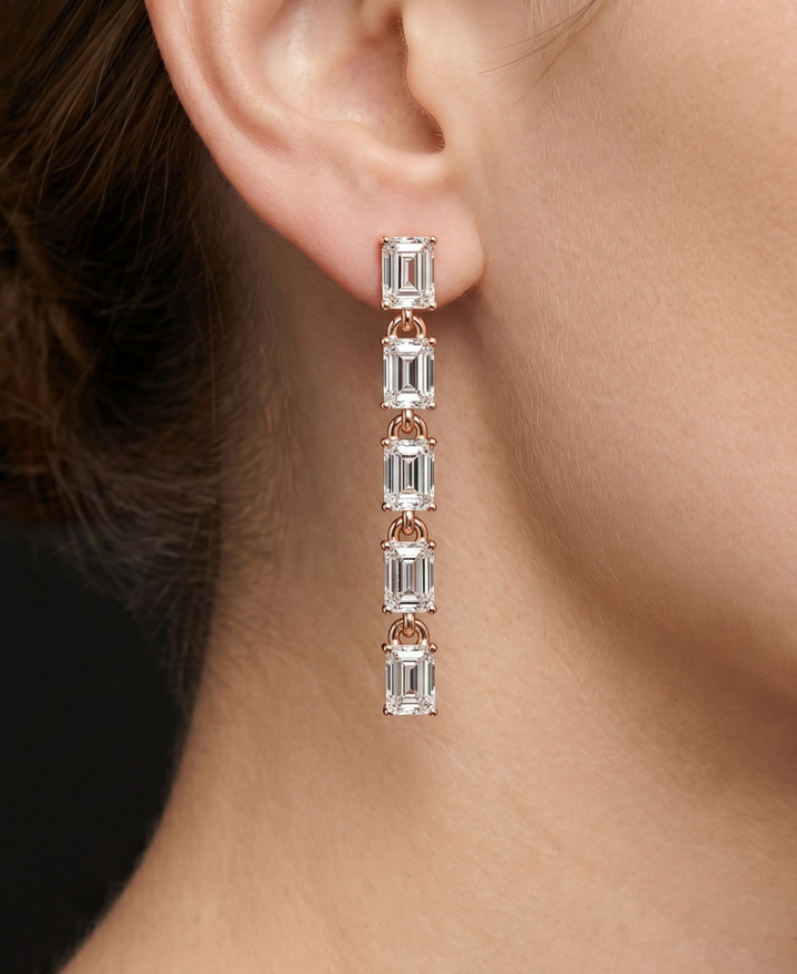 3.20 CT emerald lab-grown diamond drop earrings by Kiashaa Jewellery in rose gold with five linked stones.