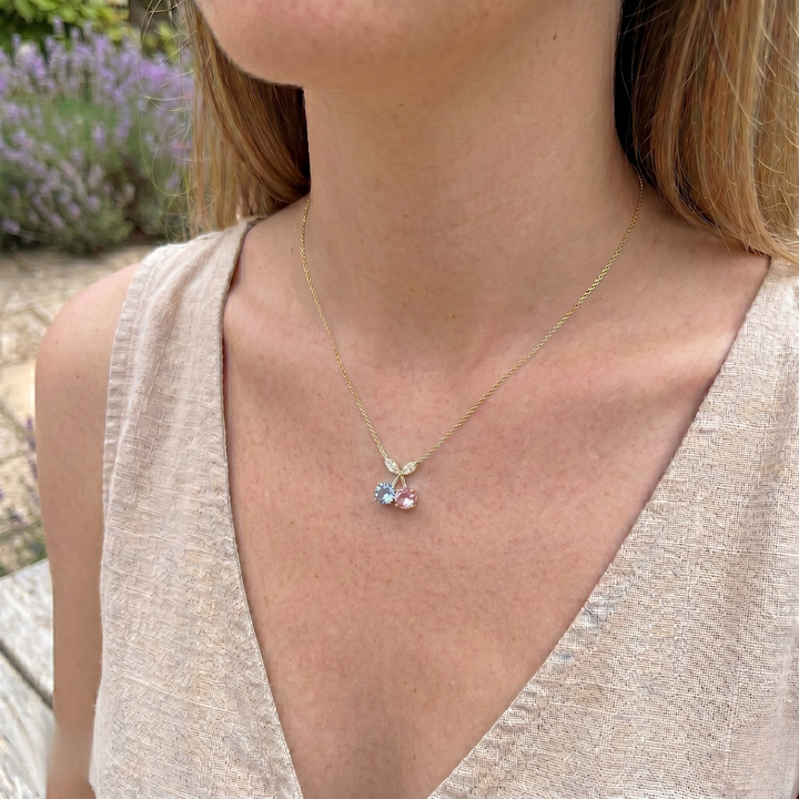 Blue and pink gemstone cherry pendant necklace with marquise lab-grown diamonds by Kiashaa Jewellery.