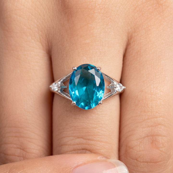 Blue oval gemstone solitaire ring with marquise lab-grown diamonds by Kiashaa Jewellery.