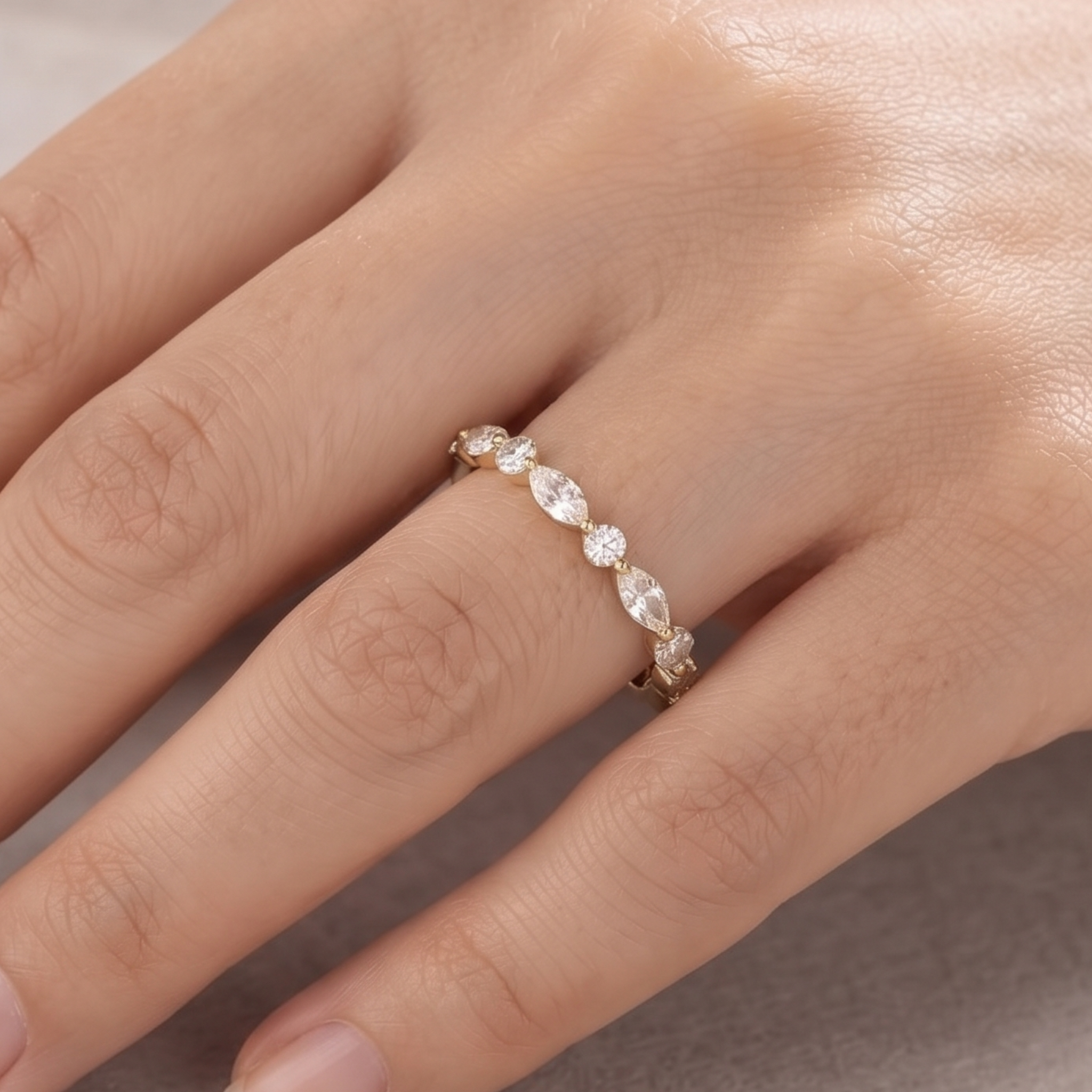 Marquise and round diamond wedding band by Kiashaa Jewellery in polished yellow gold.