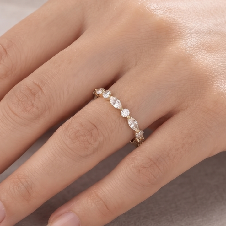Marquise and round diamond wedding band by Kiashaa Jewellery in polished yellow gold.