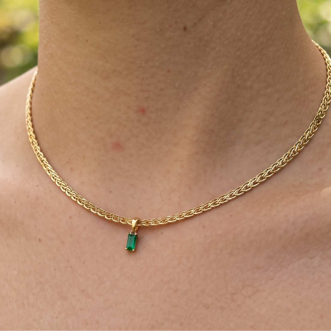 1.98 CT green emerald-cut pendant necklace in polished yellow gold.