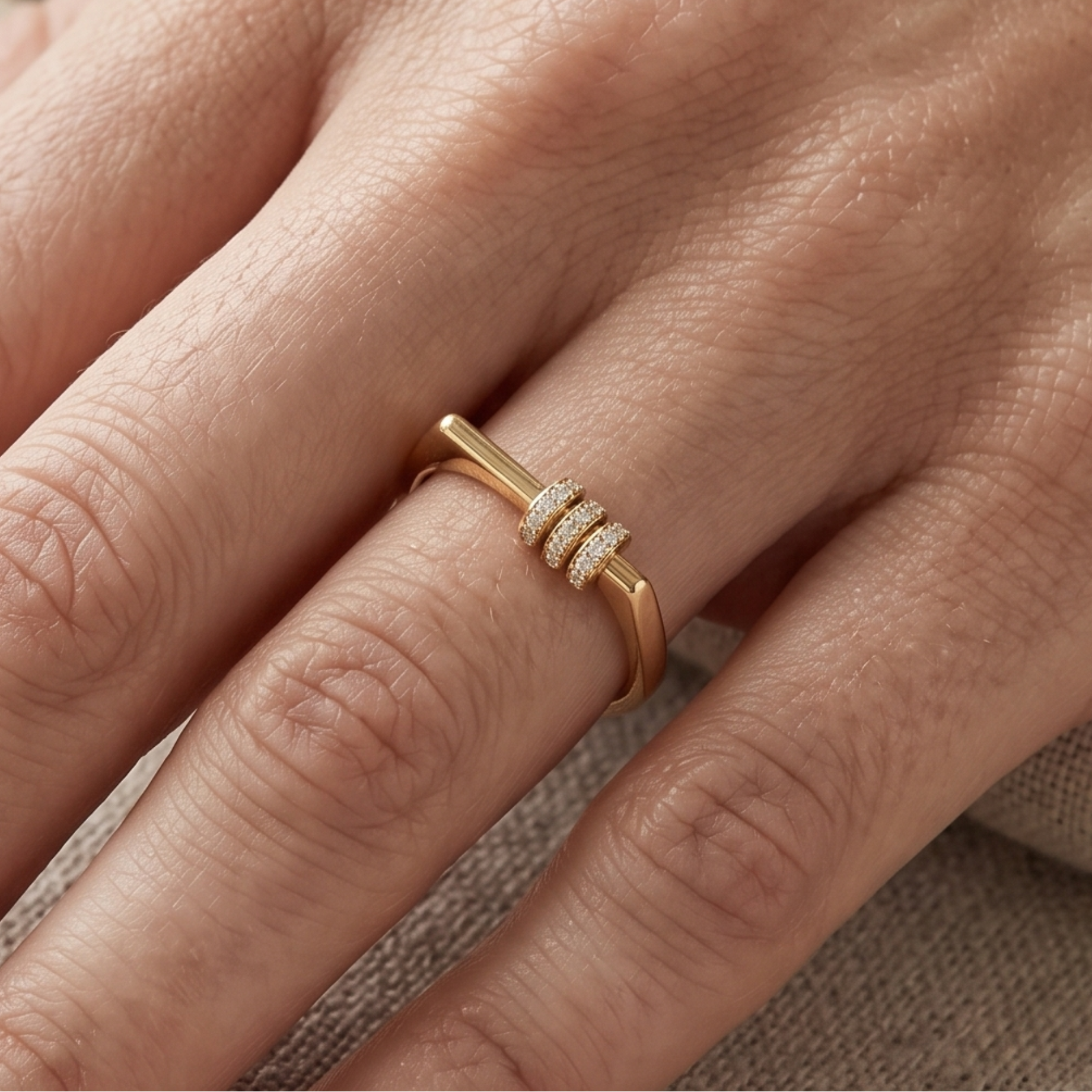 Kiashaa Jewellery 0.21 CTW triple-row diamond ring in polished yellow gold.