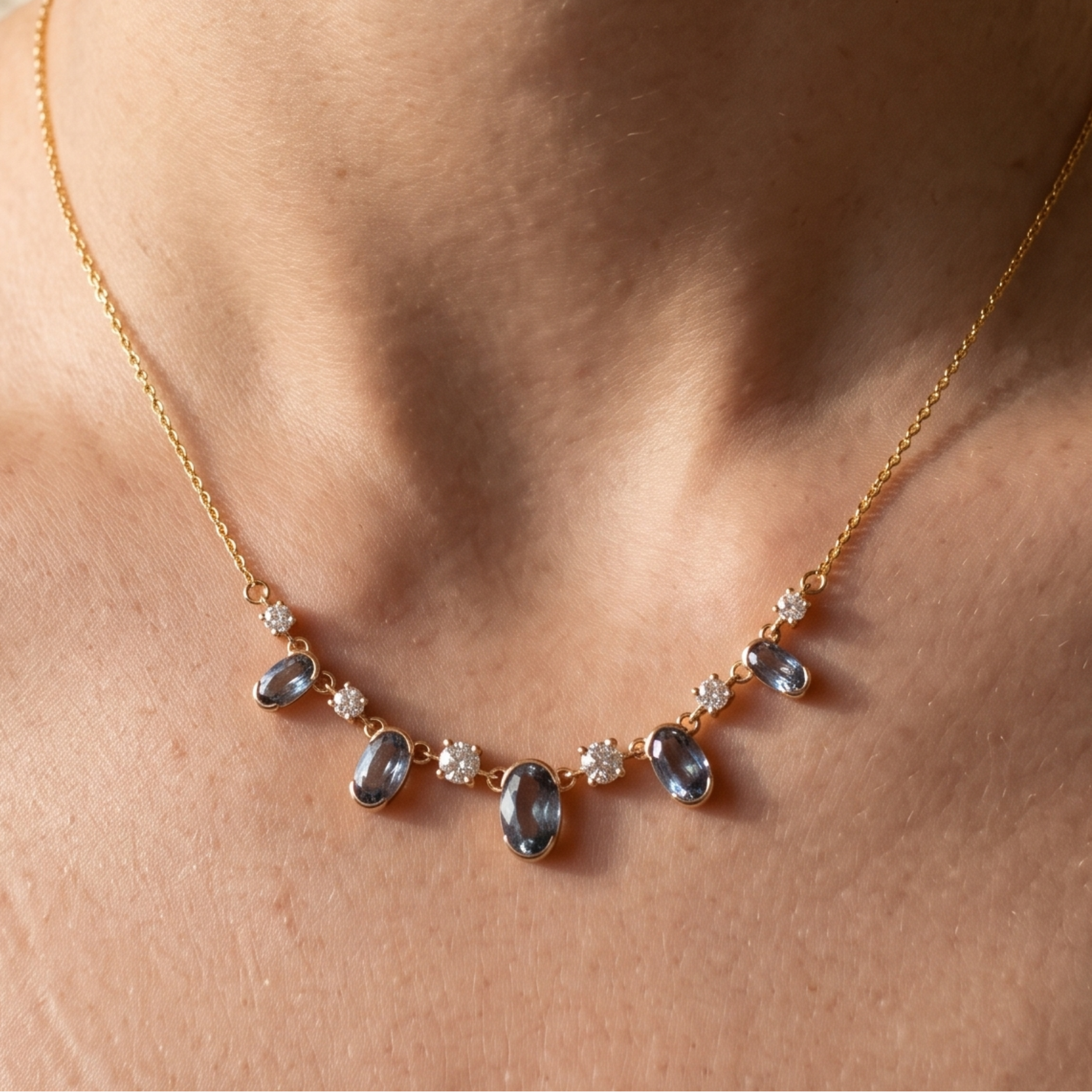 4.20 CTW oval and round diamond station necklace in polished yellow gold.