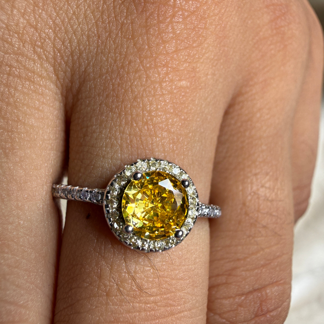 Yellow round gemstone halo ring with lab-grown diamonds by Kiashaa Jewellery.
