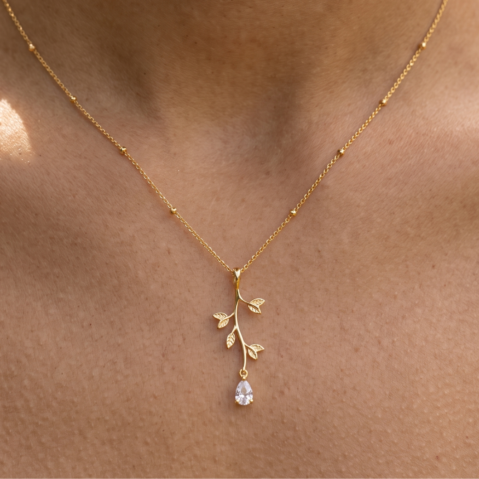 Kiashaa Jewellery 0.39 CT pear diamond leaf pendant necklace in polished yellow gold.