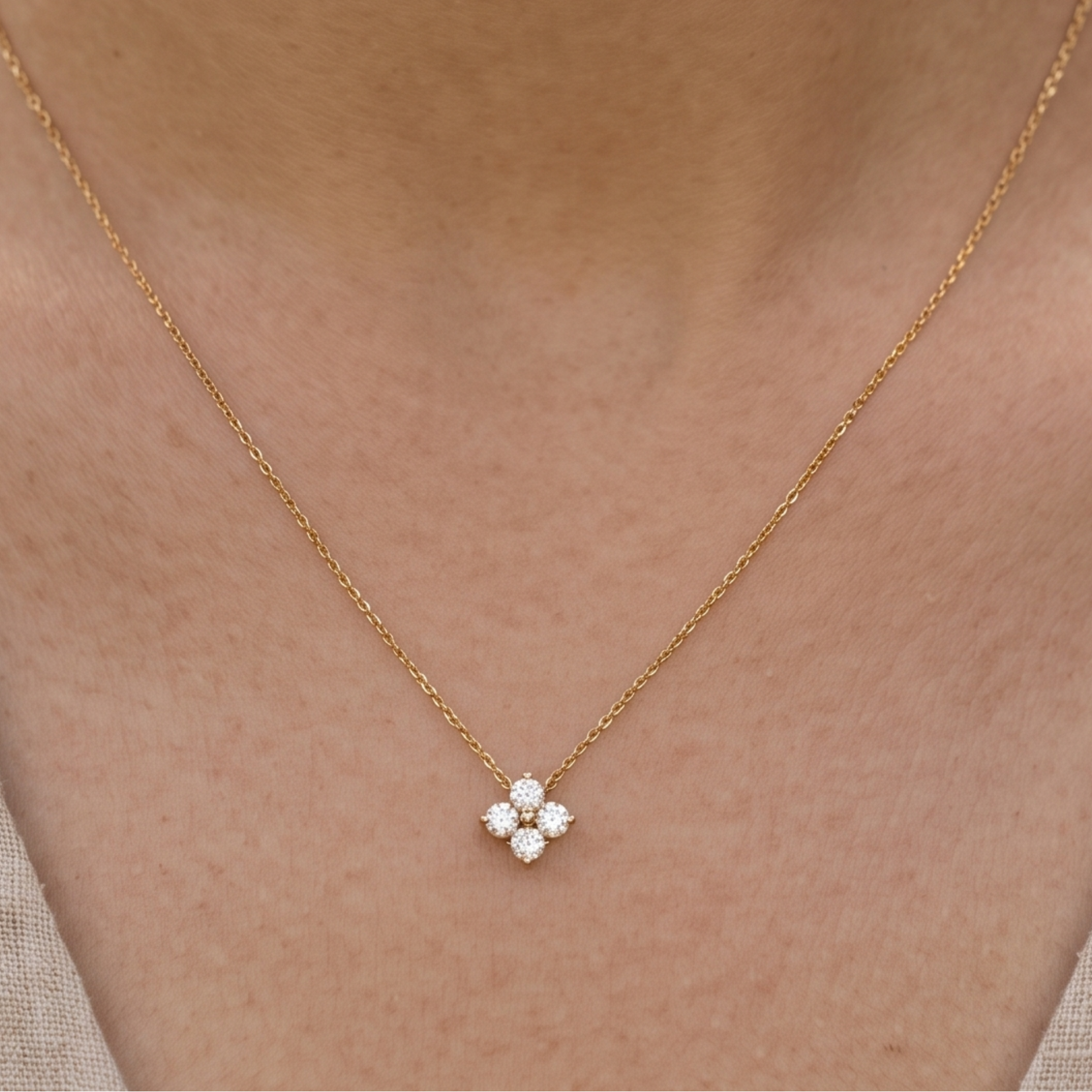 Kiashaa Jewellery 0.14 CTW round diamond flower necklace in polished yellow gold.
