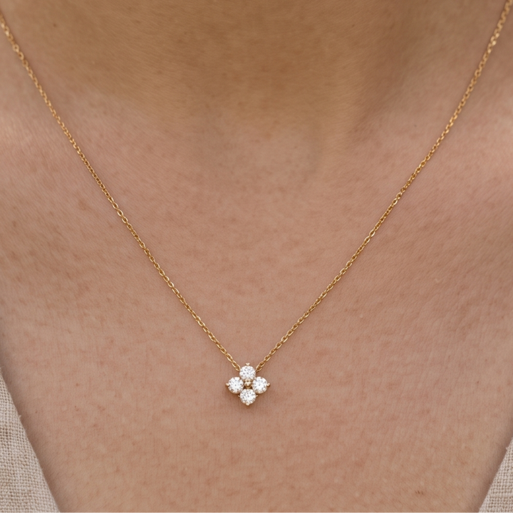 Kiashaa Jewellery 0.14 CTW round diamond flower necklace in polished yellow gold.