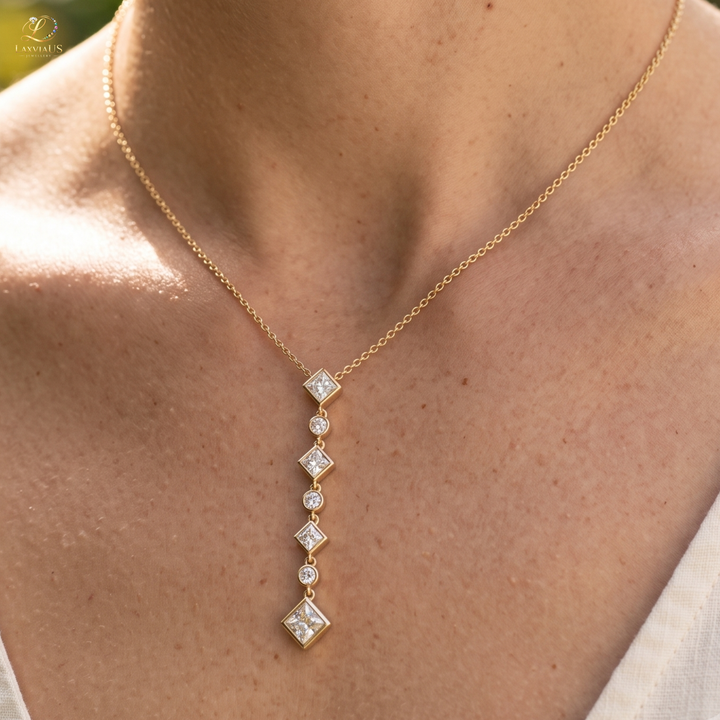 Kiashaa Jewellery 5.32 CTW princess and round diamond drop necklace in polished yellow gold.