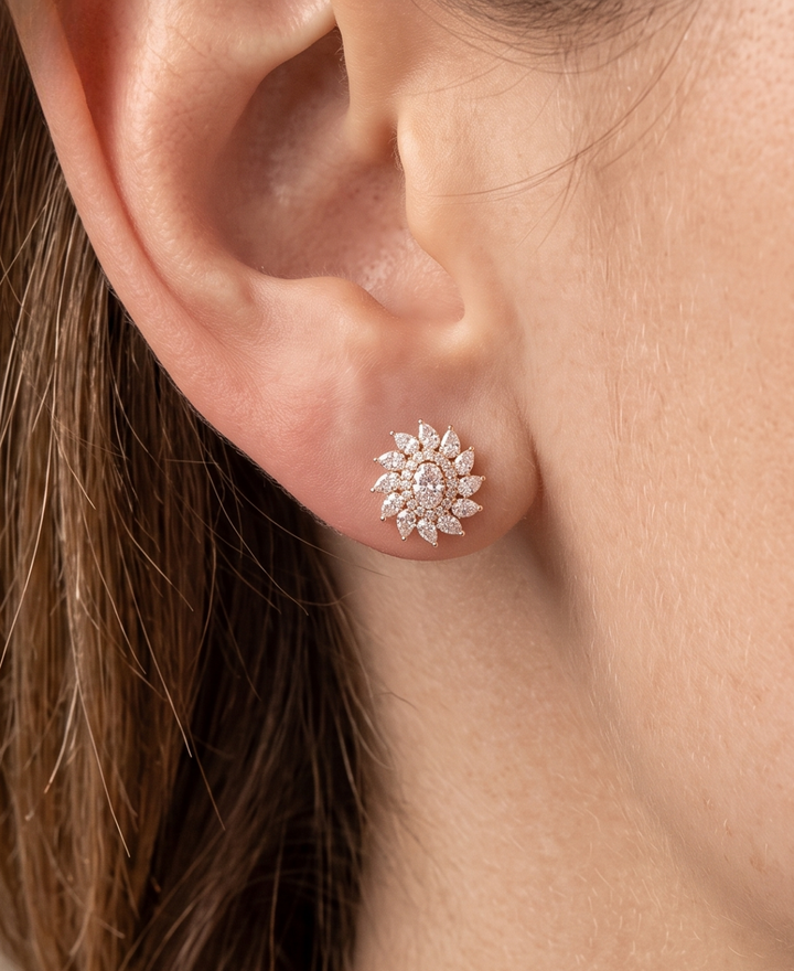 Model wearing 3.720 CTW oval, pear and round lab-grown diamond floral stud earrings by Kiashaa Jewellery.