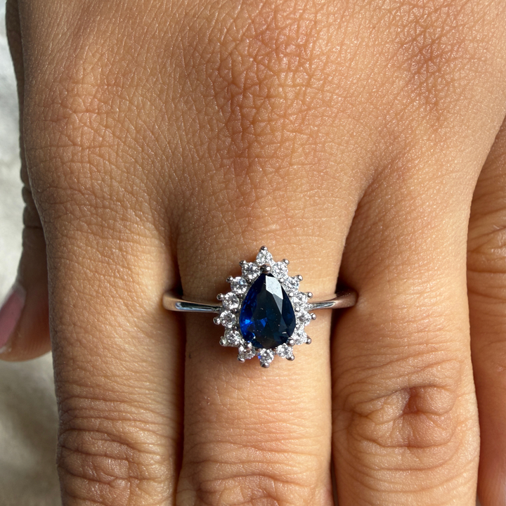 Blue pear gemstone and lab-grown diamond halo ring by Kiashaa Jewellery.
