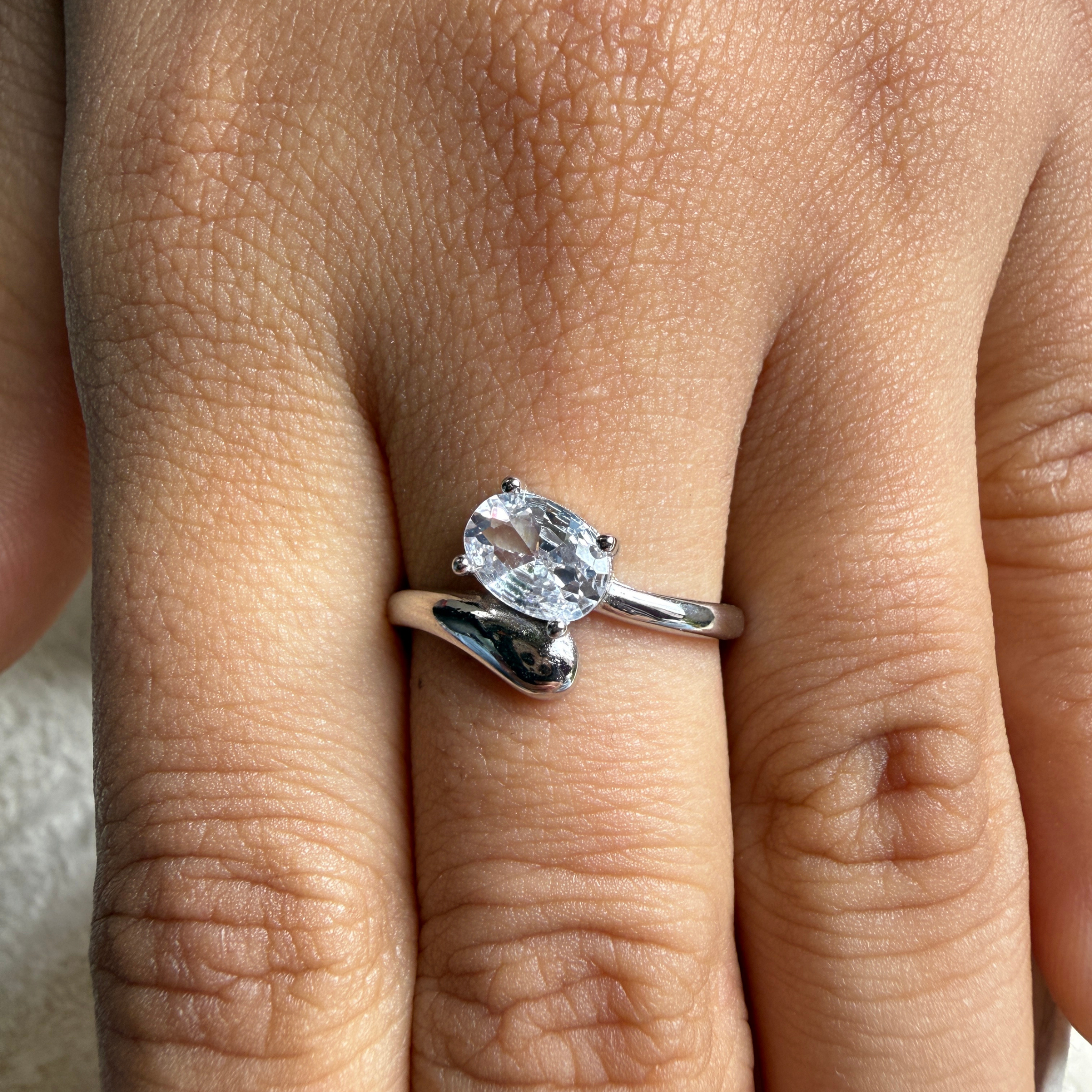 Oval lab-grown diamond bypass solitaire ring in white gold by Kiashaa Jewellery.