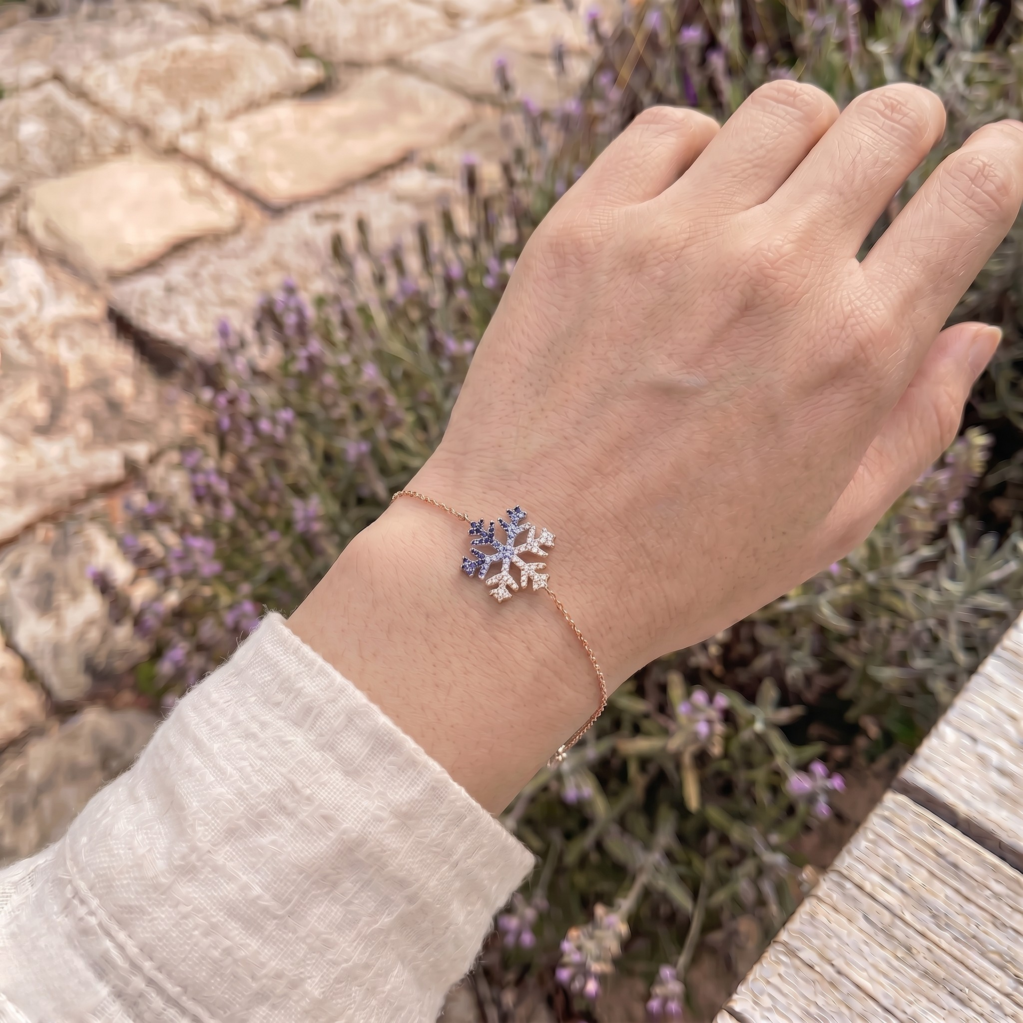 Blue gemstone and lab-grown diamond snowflake bracelet by Kiashaa Jewellery.