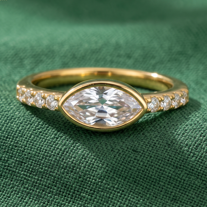 0.42 CT east-west marquise diamond bezel ring in yellow gold
