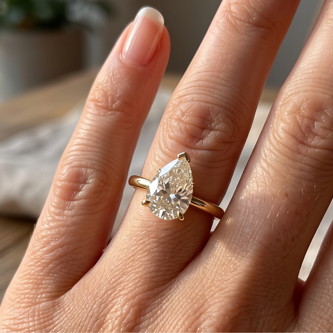 Kiashaa Jewellery 0.76 CT pear solitaire diamond ring in polished yellow gold.