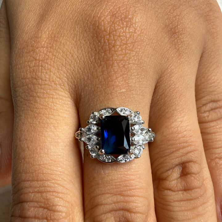 Blue emerald gemstone and lab-grown diamond halo ring by Kiashaa Jewellery.