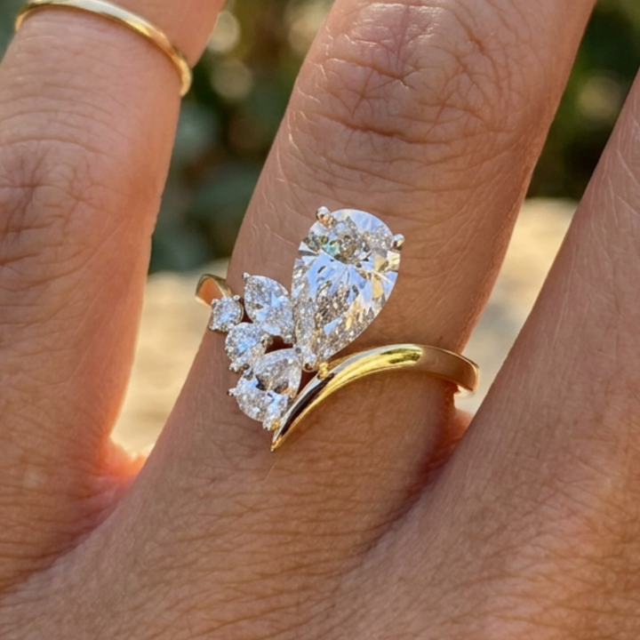 Flora Embrace 3 CTW lab-grown diamond ring by Kiashaa Jewellery with a 2 CT pear center and multi-shape side diamonds.