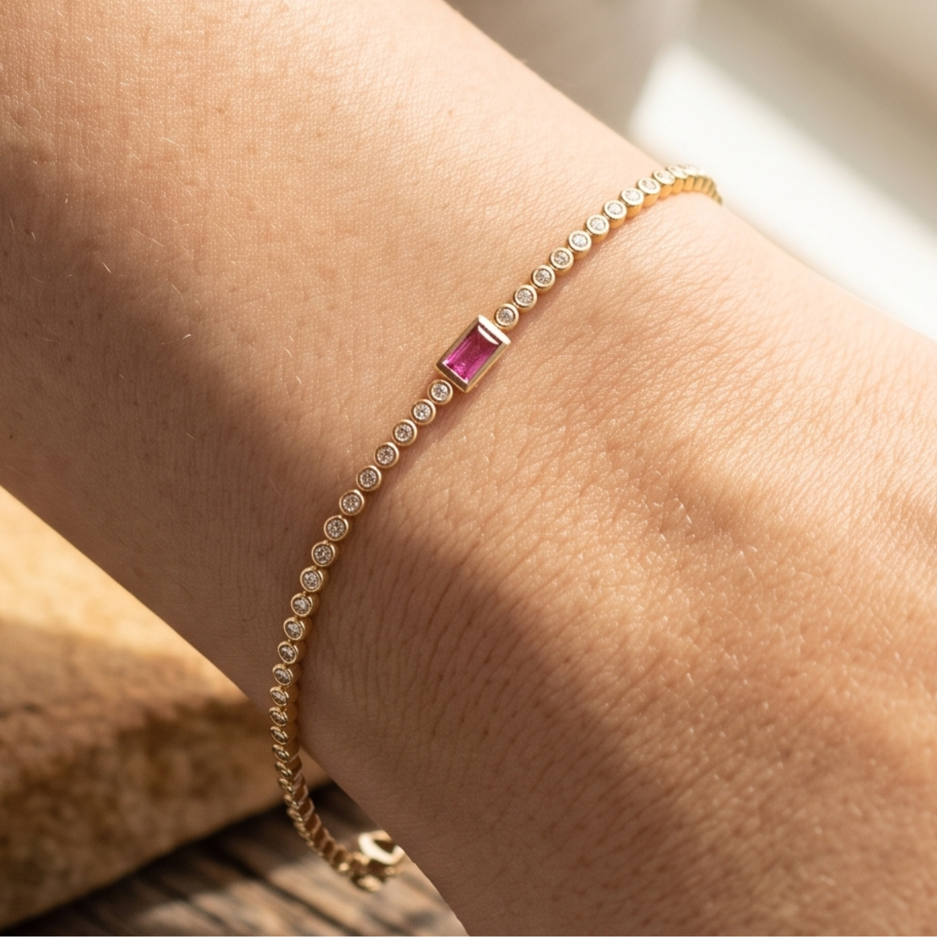 Kiashaa Jewellery 1.75 CTW diamond tennis bracelet with pink baguette center stone in yellow gold.