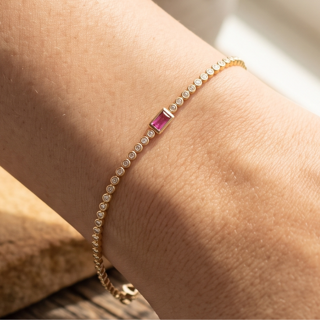 Kiashaa Jewellery 1.75 CTW diamond tennis bracelet with pink baguette center stone in yellow gold.