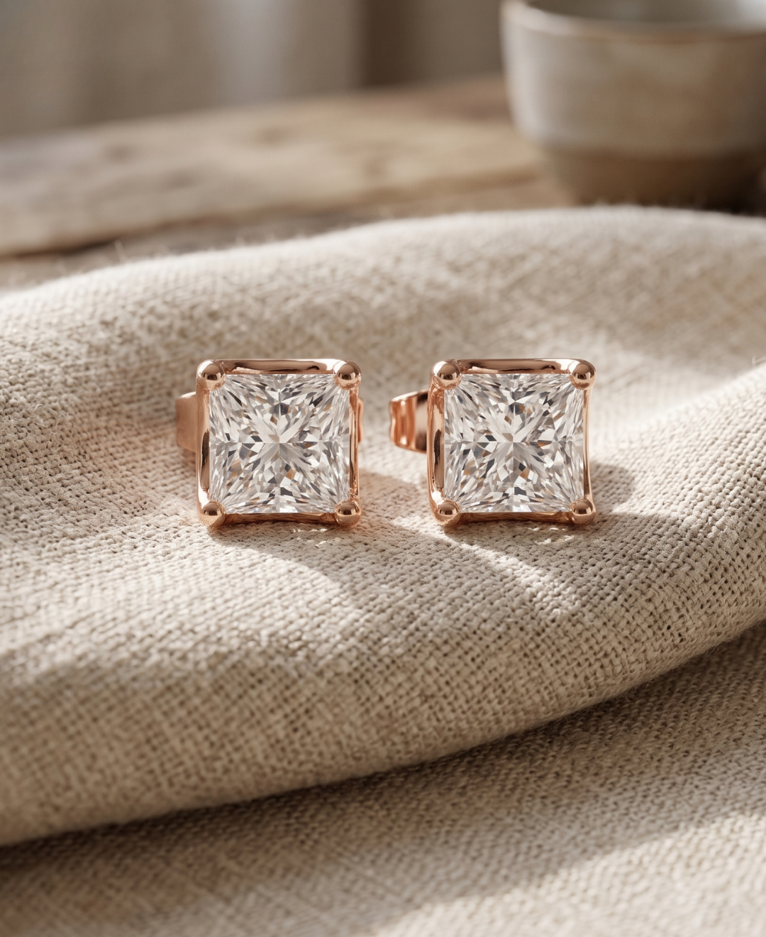 Classic princess-cut lab-grown diamond stud earrings in a four-prong rose gold setting.