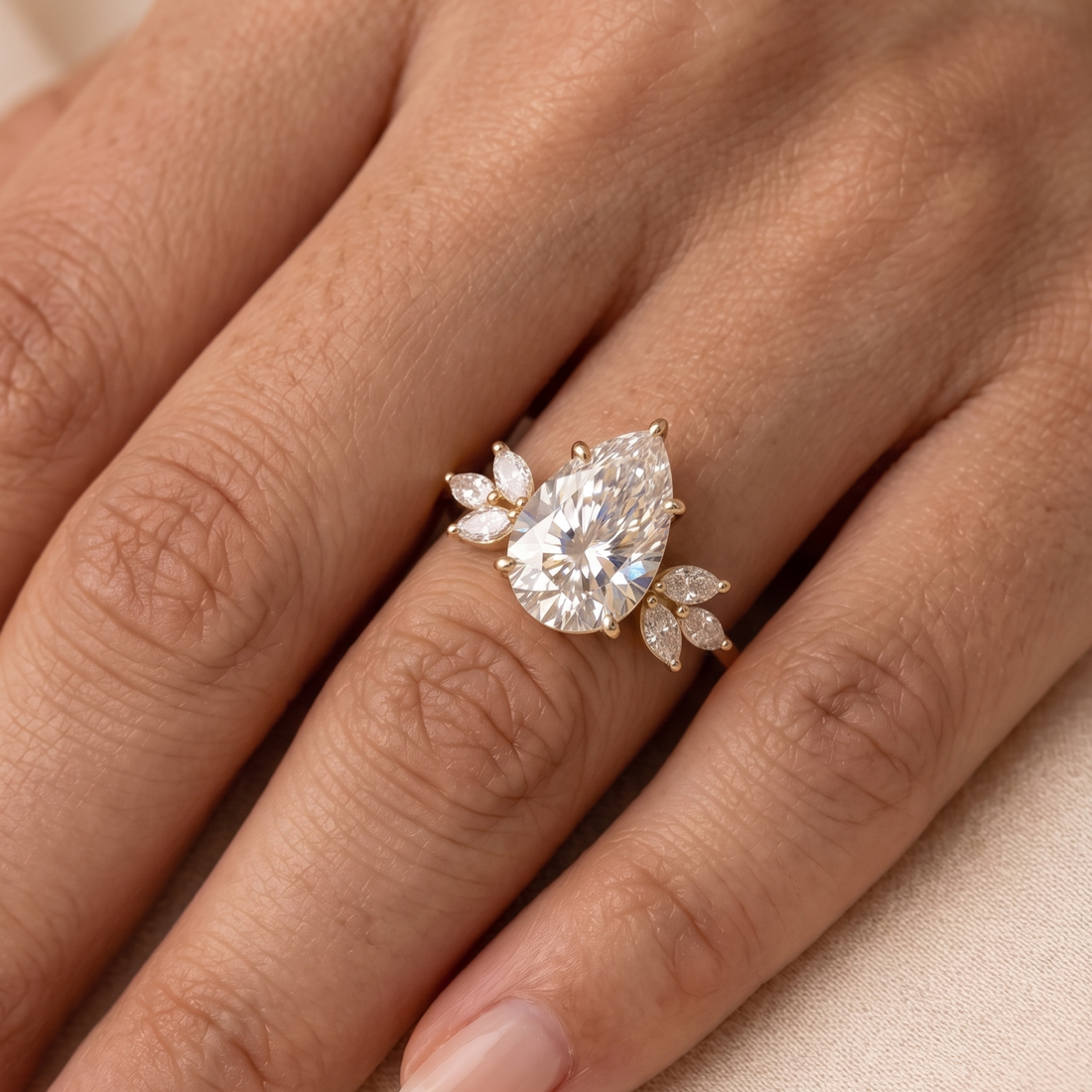 1.08 CT pear center diamond ring with six marquise side diamonds
