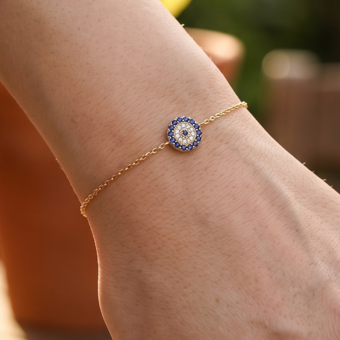 1.00 CT blue gemstone and diamond evil eye bracelet in yellow gold by Kiashaa Jewellery.