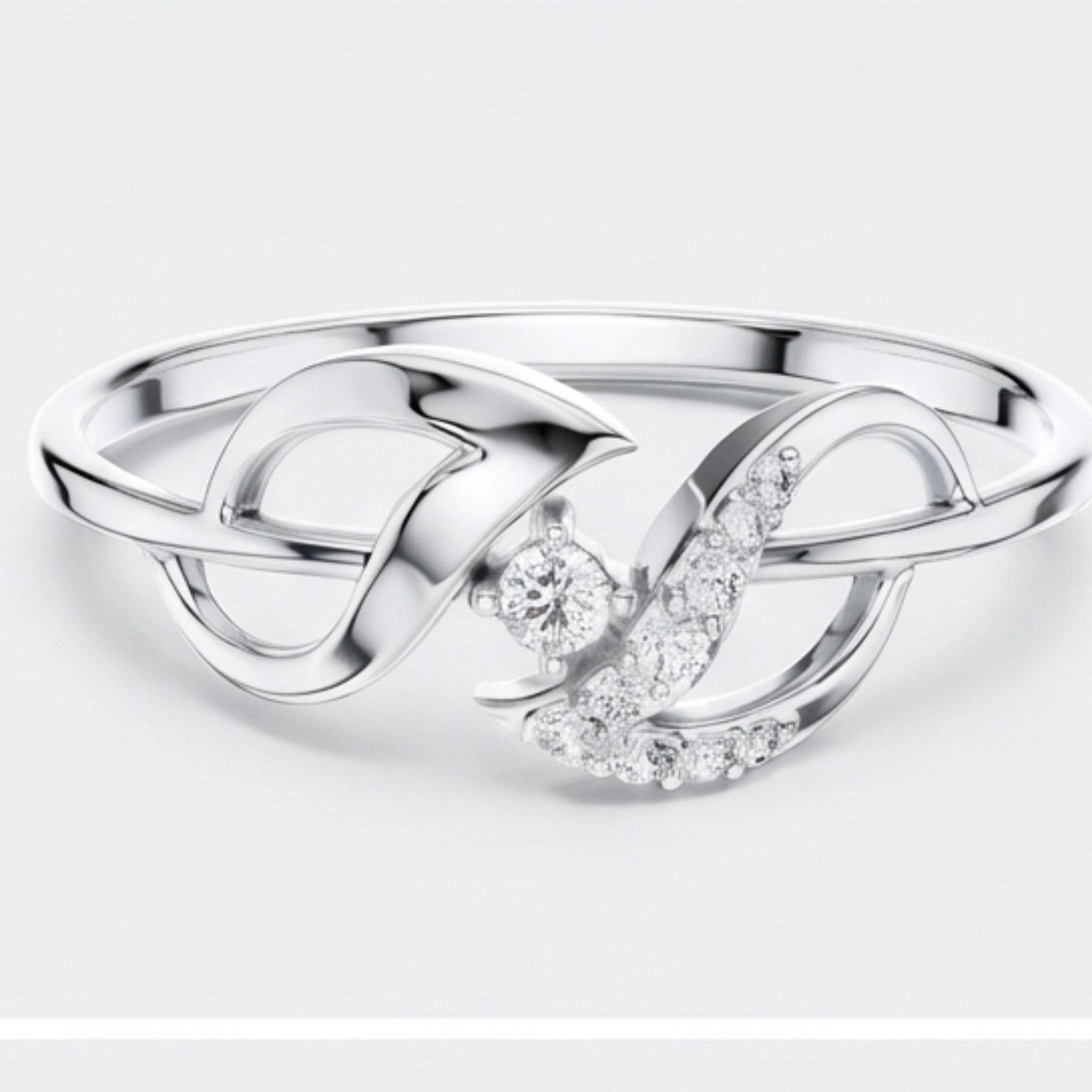 A silver ring featuring a polished infinity symbol design with a central round clear gemstone and a curved section paved with small clear stones, shown on a light gray background.