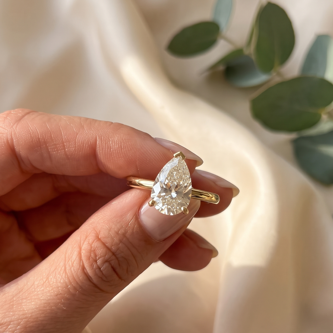 Kiashaa Jewellery 0.76 CT pear solitaire diamond ring in polished yellow gold.