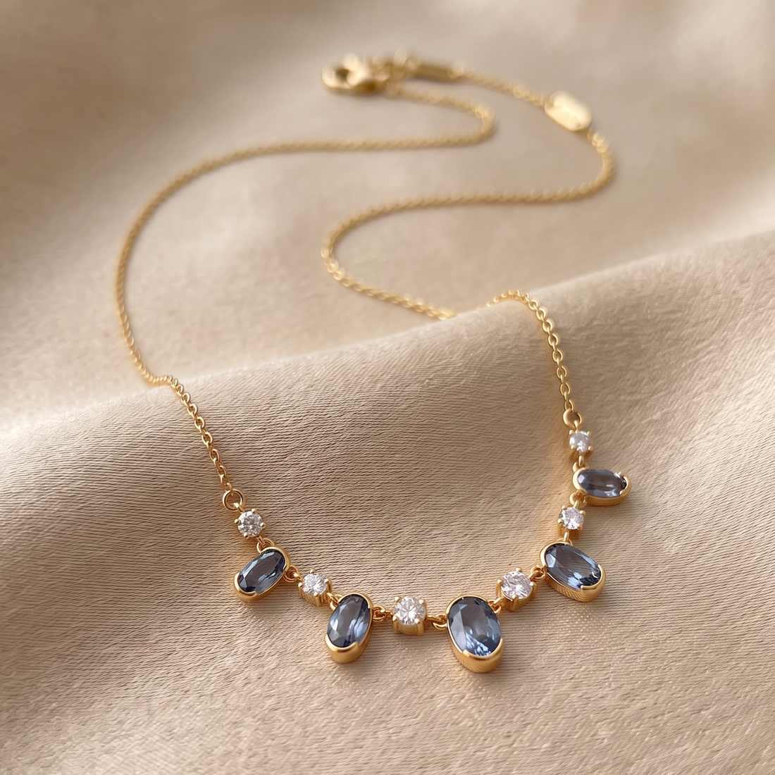 4.20 CTW oval and round diamond station necklace in polished yellow gold.