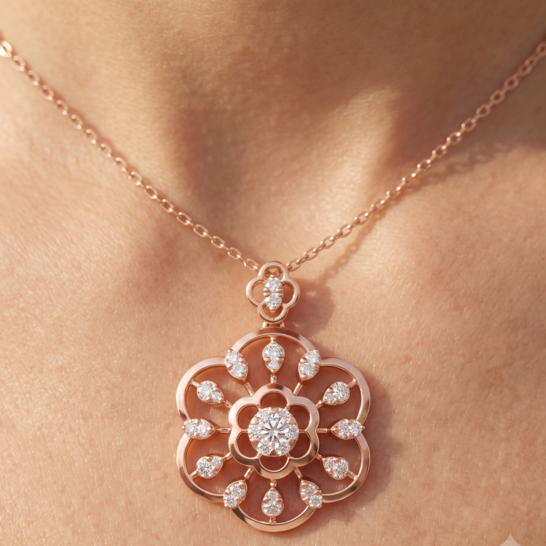 A close-up of a rose gold floral pendant necklace with clear gemstones, worn on a model's neck.