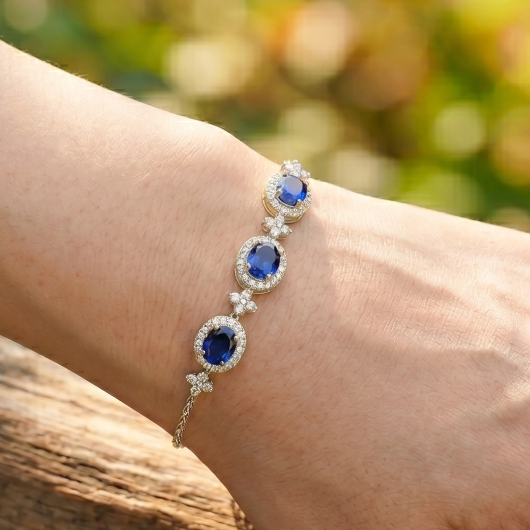 Royal blue oval gemstone bracelet with round lab-grown diamond halos by Kiashaa Jewellery.
