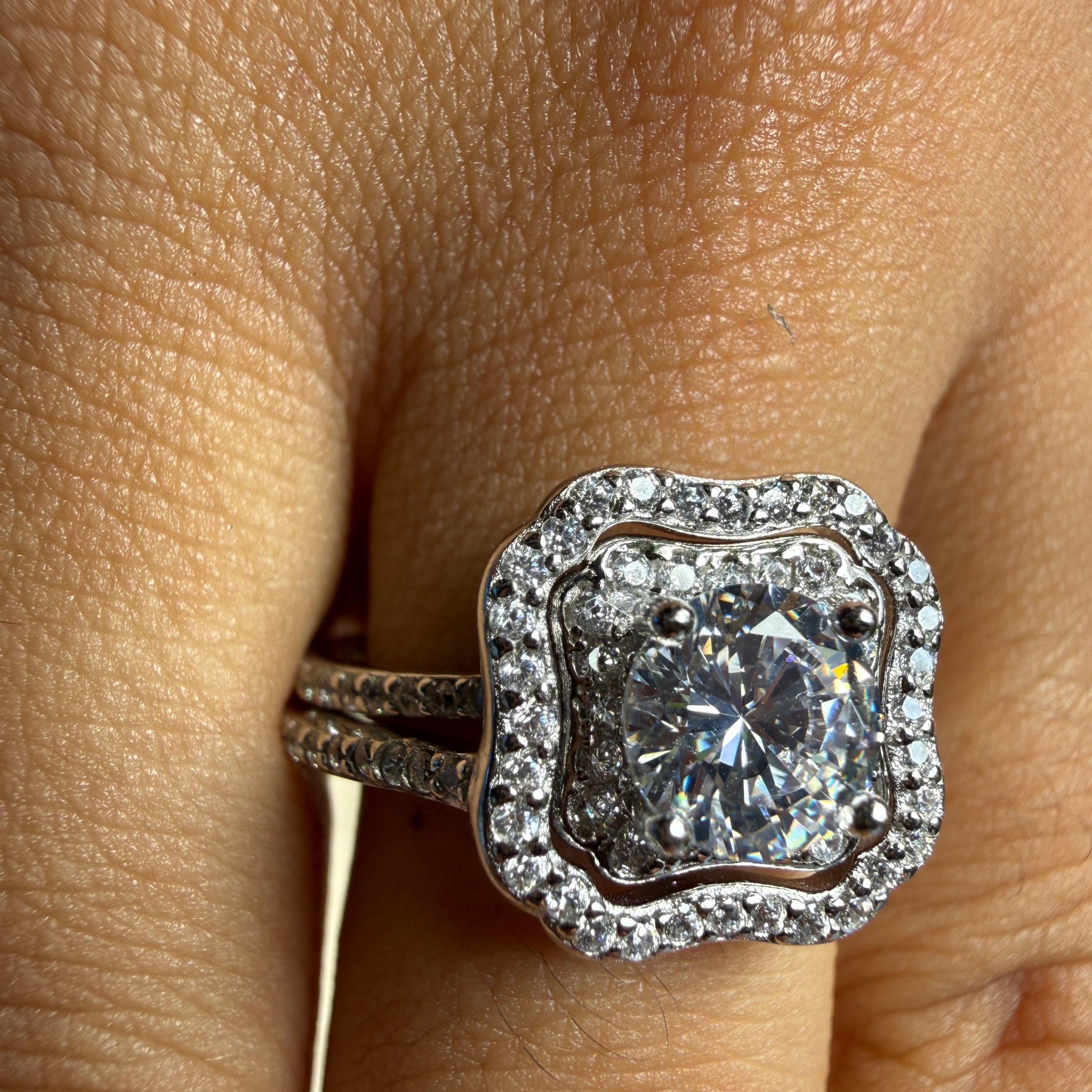 Round halo lab-grown diamond engagement ring in white gold by Kiashaa Jewellery.