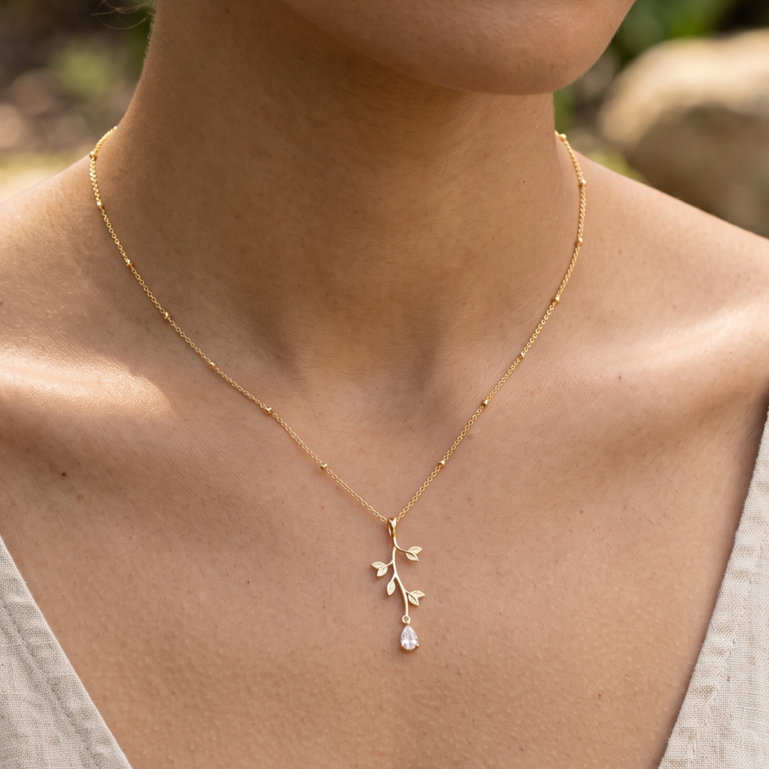 Kiashaa Jewellery 0.39 CT pear diamond leaf pendant necklace in polished yellow gold.