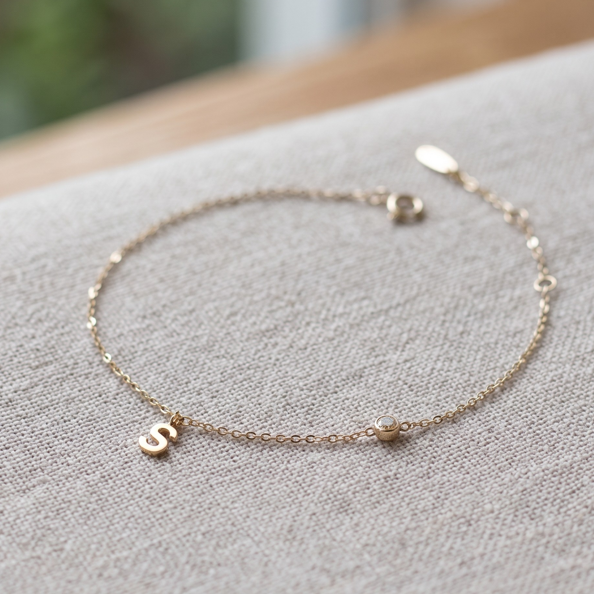 Kiashaa Jewellery personalized initial bracelet with 2.5 mm round diamond in yellow gold.