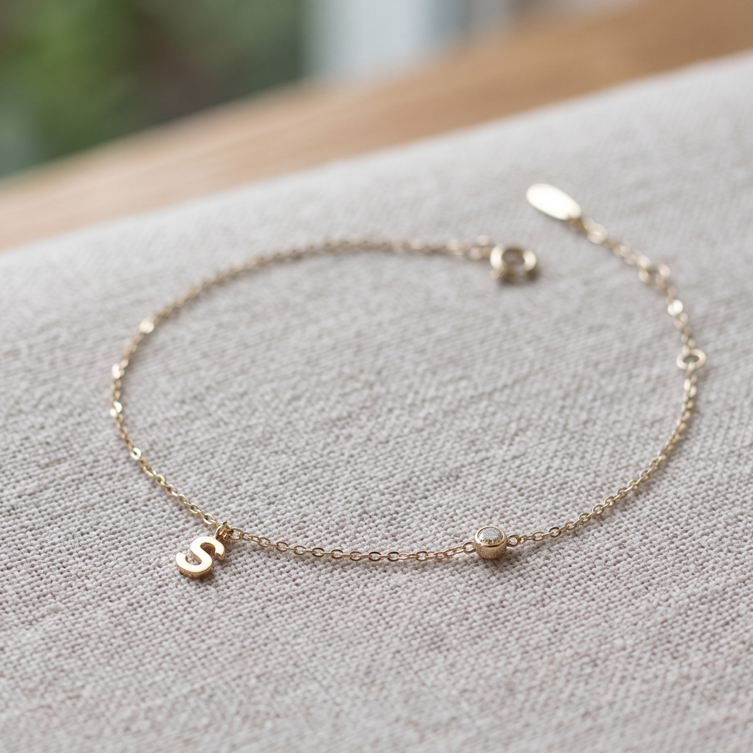 Kiashaa Jewellery personalized initial bracelet with 2.5 mm round diamond in yellow gold.