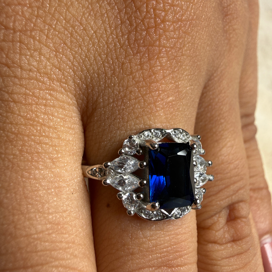 Blue emerald gemstone and lab-grown diamond halo ring by Kiashaa Jewellery.